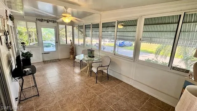 Sunroom featuring tile flooring