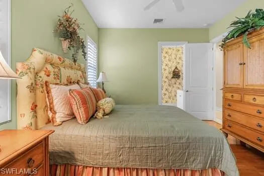 Bedroom featuring ceiling fan and wood-type flooring