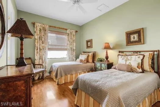 Bedroom with light wood-type flooring and ceiling fan