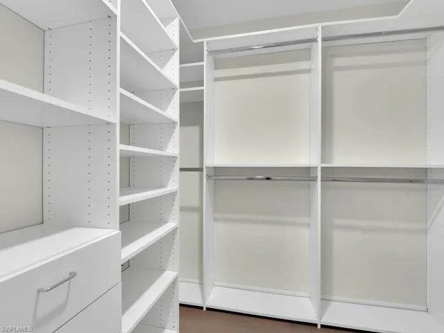 Walk in closet featuring hardwood / wood-style flooring