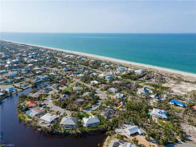 Bird's eye view featuring a view of the beach and a water view