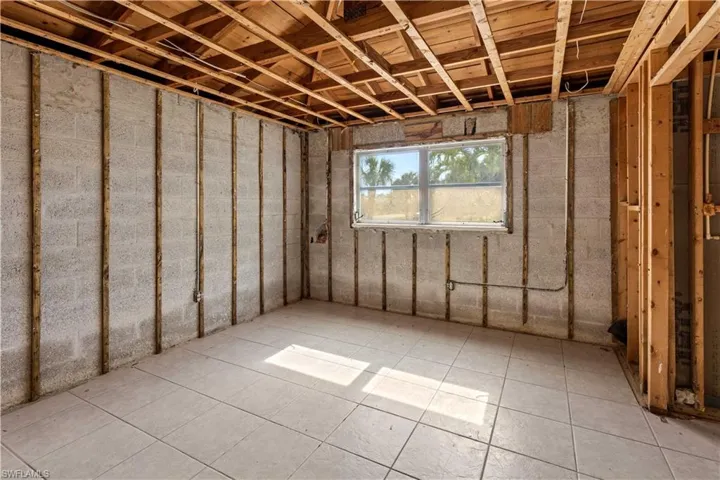 Basement featuring light tile flooring