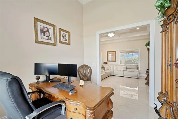 Home office with light tile floors