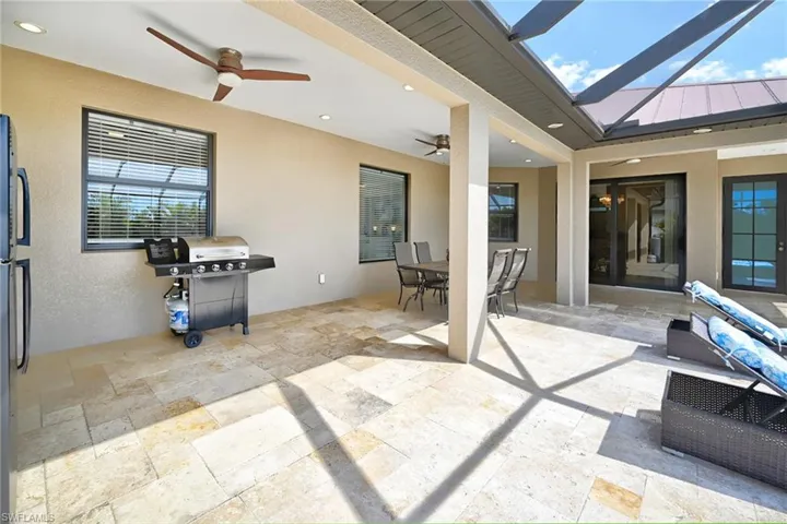 View of terrace featuring grilling area and ceiling fan