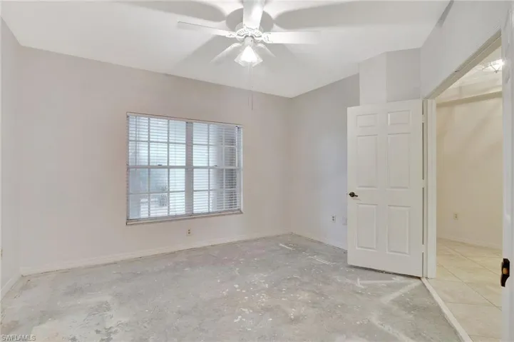 Spare room with ceiling fan