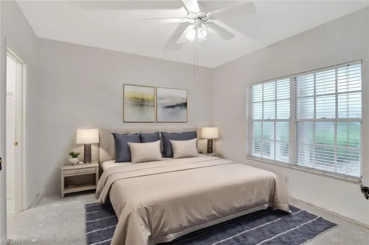 Bedroom featuring concrete floors and ceiling fan