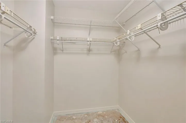 Walk in closet featuring tile patterned flooring