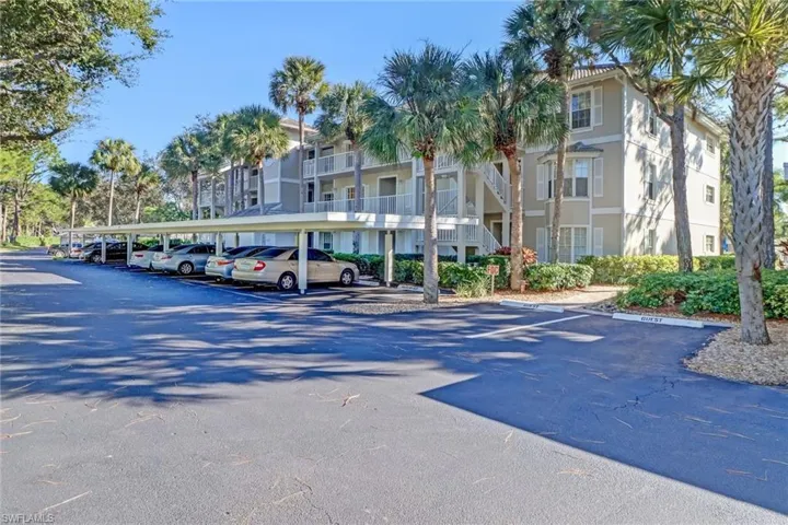 View of parking with a carport
