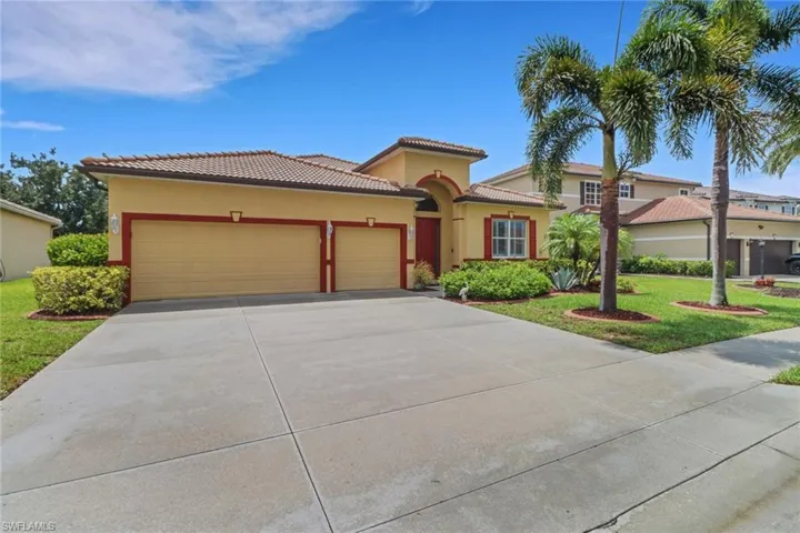 Large driveway in front of 3 car garage