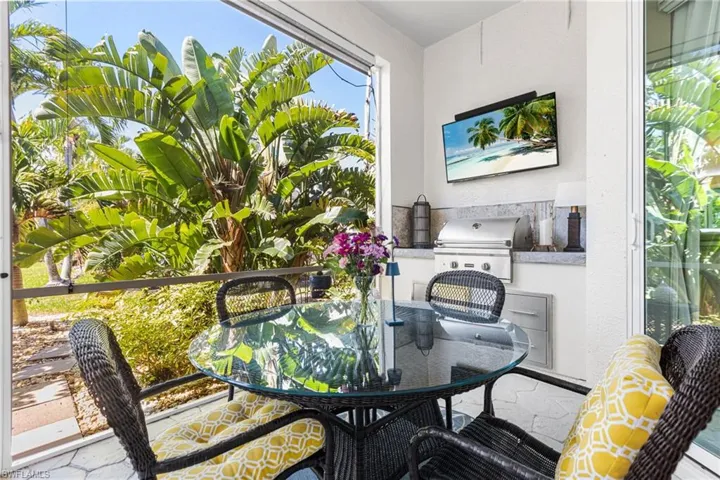 This is one of two lanai areas. Your primary bedroom has access to this lanai.  Here you have a 28" Coyote propane grill. Private and tranquil.