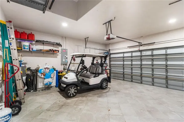 Tiled flooring in your 2 car garage. (Golf cart is not for sale)