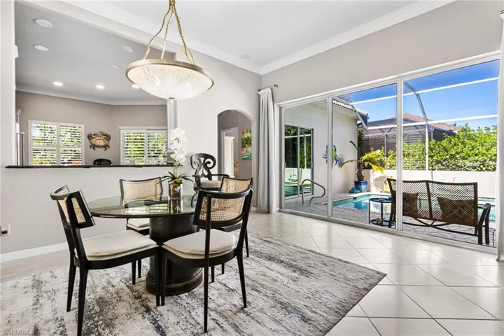 The dining area has views of the courtyard heated pool and spa.