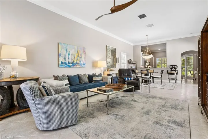 The living and dining area flow seamlessly. Pass thru window from the chef's kitchen for easy entertaining.