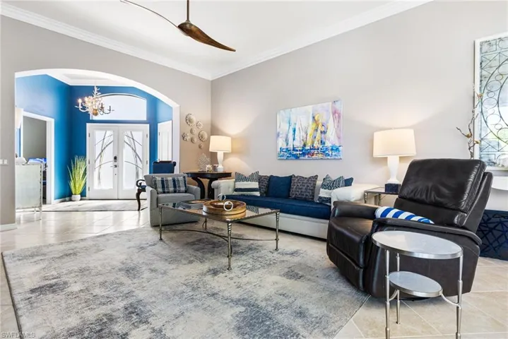 Glass double doors welcome you into your main living area. Inviting foyer, crown molding.