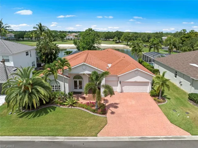 Mediterranean / spanish-style home featuring a 3 garage, a water view