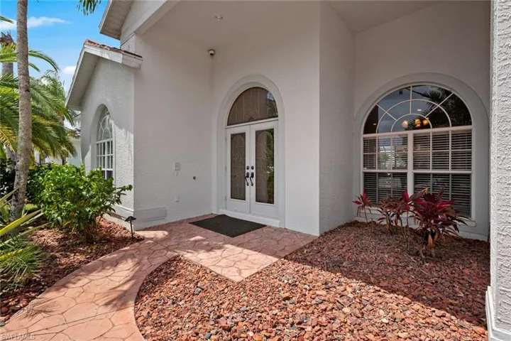 Doorway to property featuring french doors