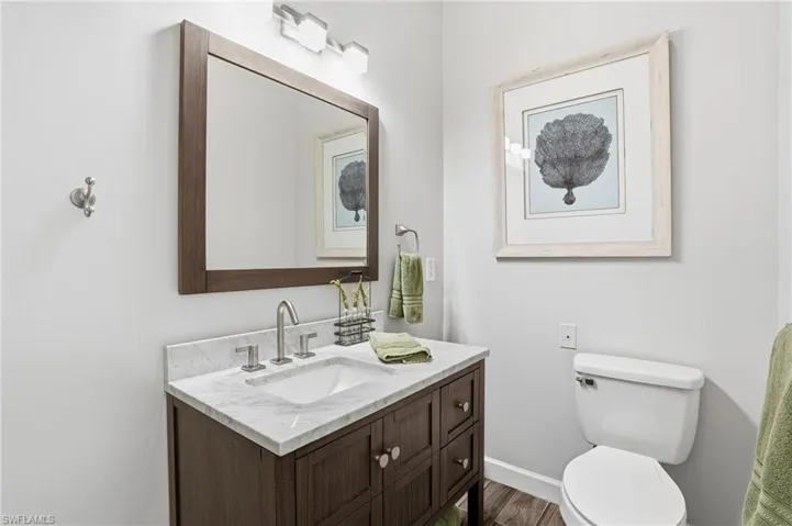 Bathroom with vanity and dark wood-type flooring - Virtually Edited Image
