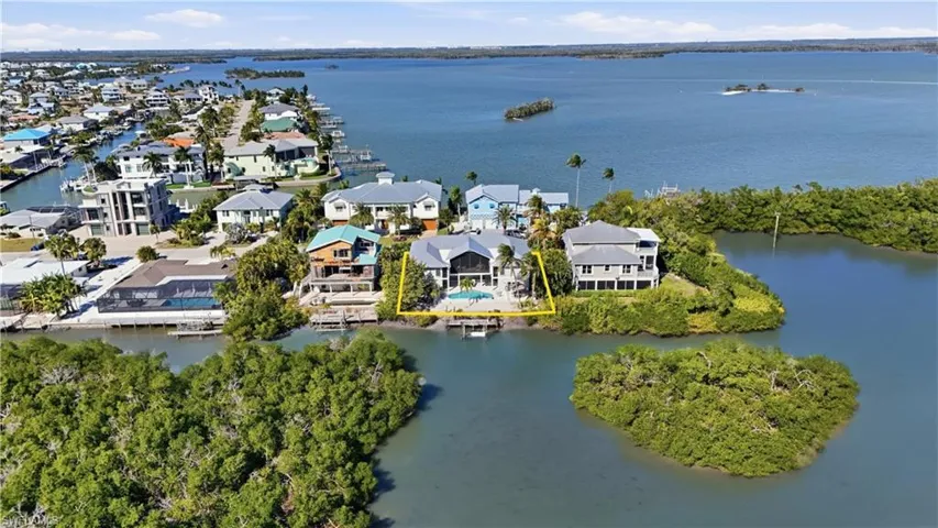 Aerial perspective of suburban area featuring a large body of water - Virtually Edited Image