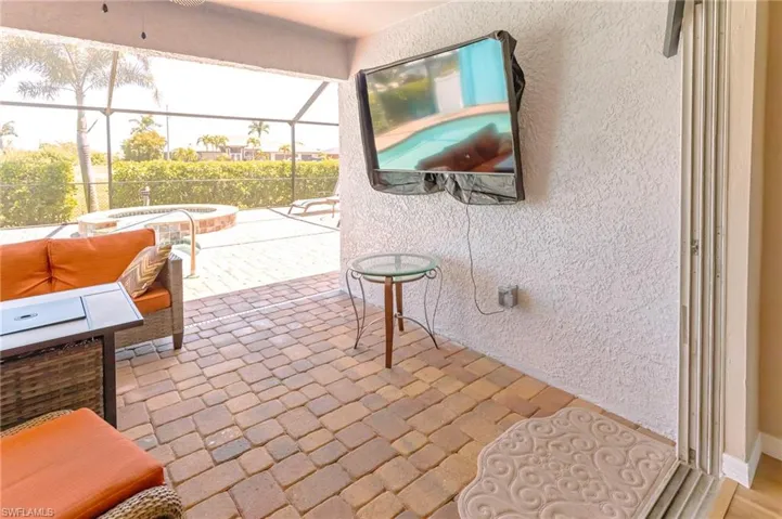 View of patio with a lanai