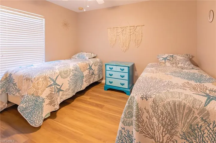 Bedroom featuring wood-type flooring