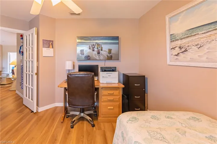 Bedroom featuring ceiling fan and light wood-type flooring