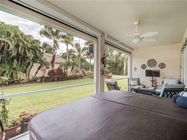 Screened lanai, hot tub and yard view