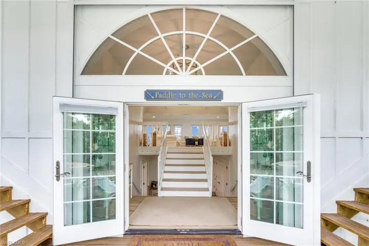 Doorway to property with board and batten siding