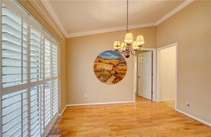 A spacious & convenient dining room with backyard views