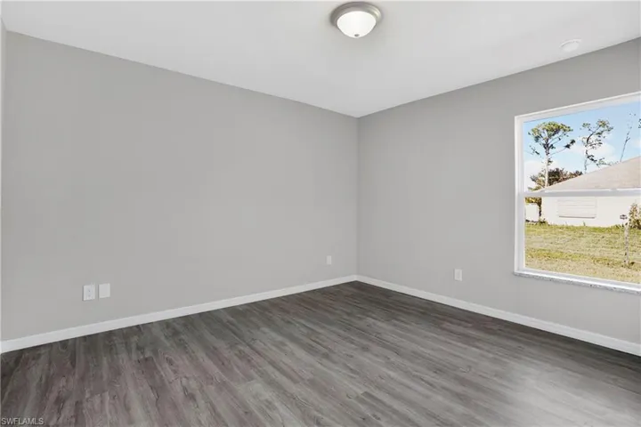 Bedroom 2 featuring grey tones laminate wood-style floors