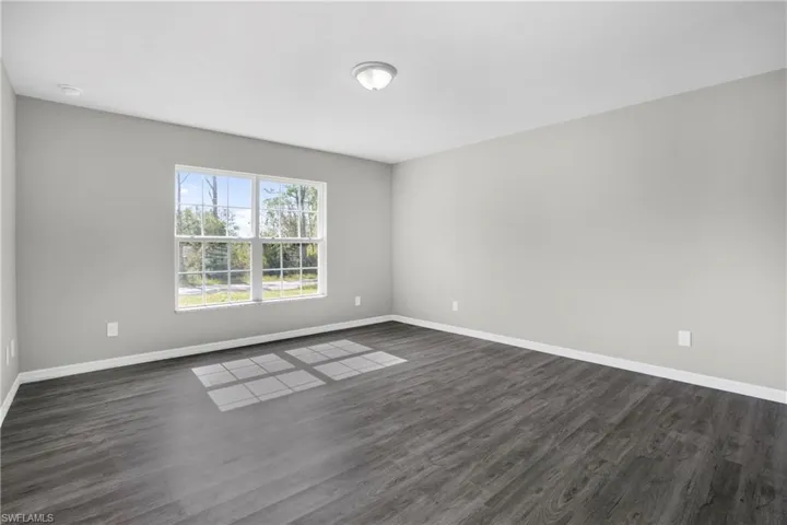 Primary Suite featuring laminate wood-type flooring