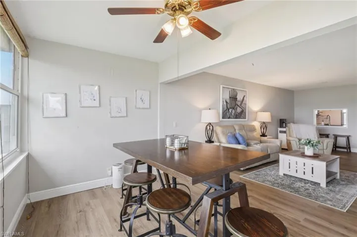 Dining room with ceiling fan and lots of natural light
