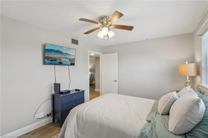 Bedroom featuring LVP floors and ceiling fan
