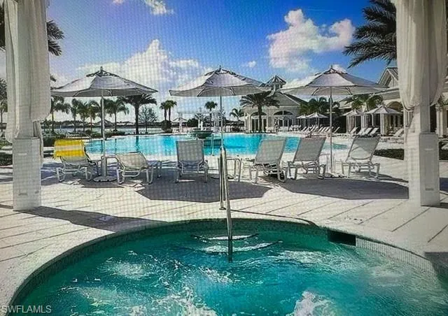 Community pool with a patio area