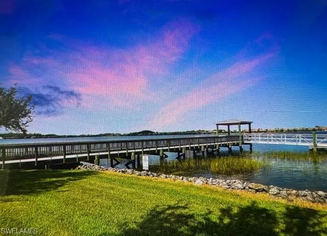 Dock area featuring a water view