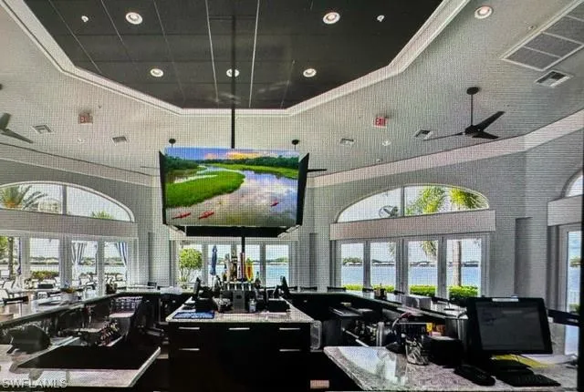 Common area featuring a towering ceiling and recessed lighting