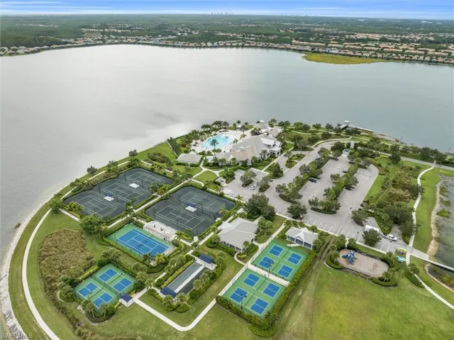 View of property location featuring a large body of water and a pool area