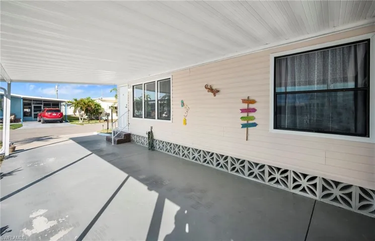 View of patio with a carport