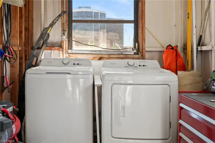 Clothes washing area with washer and clothes dryer