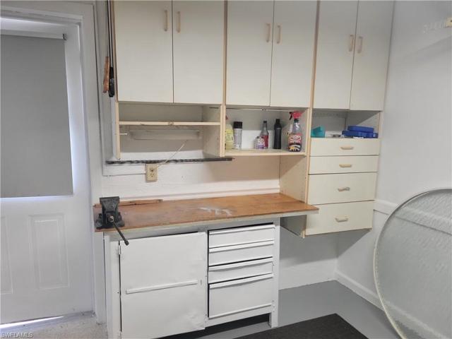 Built-in workbench and pull down stairs to attic