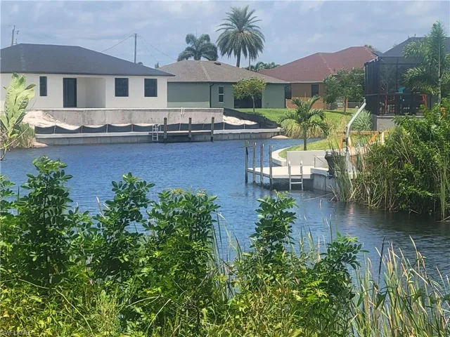 Property view of water with a dock
