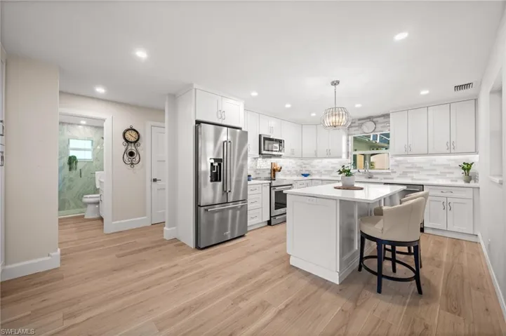 Bright, polished, and beautifully curated, this kitchen features generous storage, sleek surfaces, and a seamless integration into the home’s open living layout.