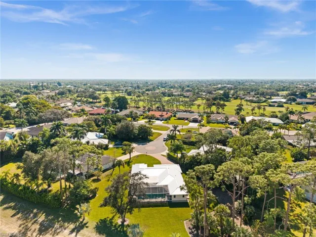 Nestled among lush natural landscapes, this residence enjoys a quiet cul-de-sac location with generous outdoor space and picturesque views in every direction.
