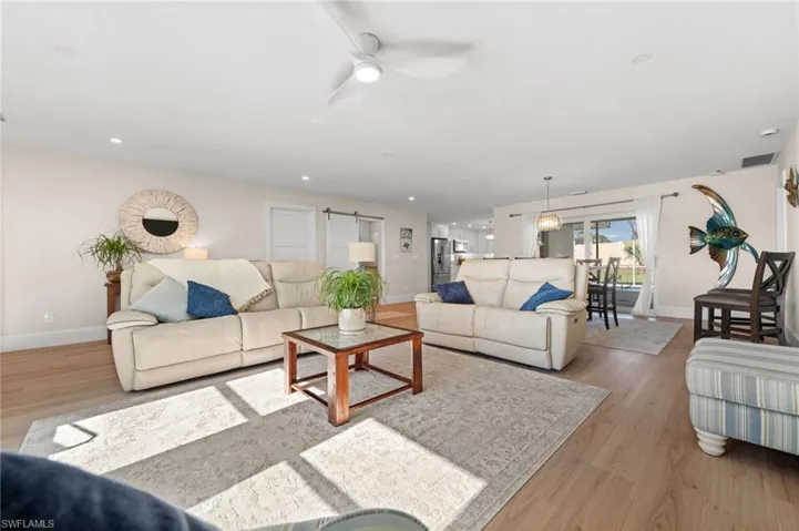 With sunlight stretching across wide-plank flooring and clean architectural lines, the heart of the home exudes calm, space, and understated luxury.