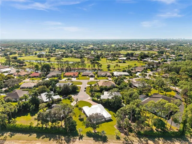 An elevated view showcasing the quiet, private setting of this gated community, perfectly placed near shops, groceries, and lifestyle conveniences.