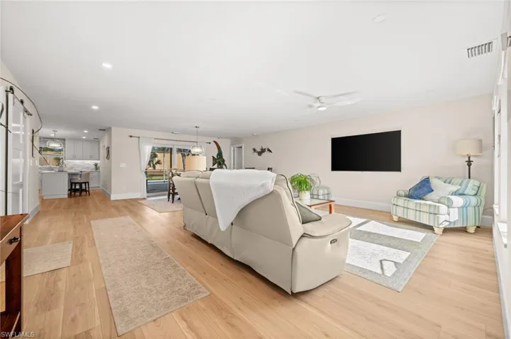 An expansive open-concept layout where living, dining, and kitchen spaces flow effortlessly, designed for both elegant entertaining and everyday ease.