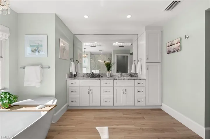 Beautifully designed for daily luxury , double sinks, generous storage, and a sleek mirrored wall create a serene setting for morning and evening routines.