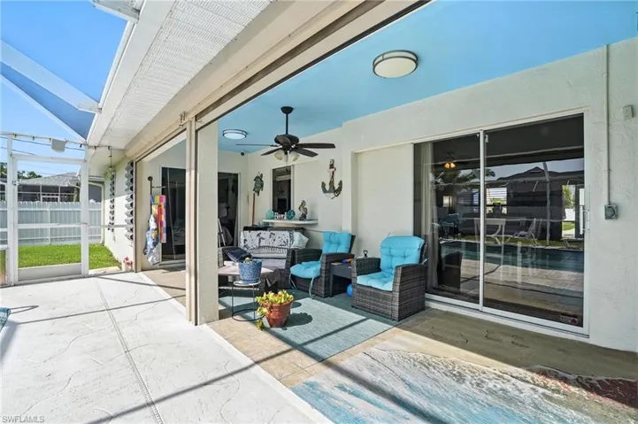 View of patio featuring outdoor lounge area, a ceiling fan, a grill, a lanai, and an outdoor pool