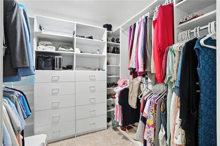Laundry room with washing machine and clothes dryer and cabinet space