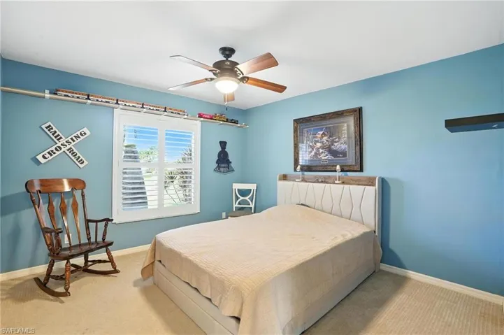 View of pool with a patio area, a ceiling fan, a lanai, and a grill
