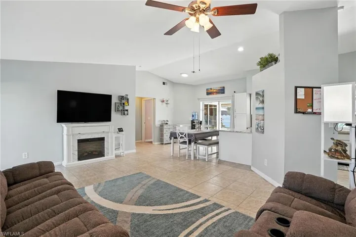 Kitchen with stainless steel dishwasher, white cabinets, white electric range oven, and recessed lighting